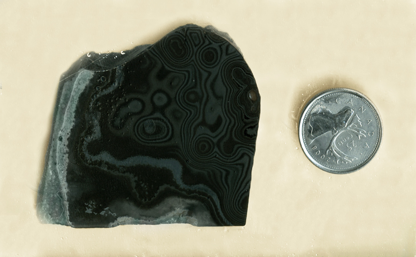 Oozing black and gray patterns on a slab of Psilomelane (Merlinite) from Mexico - Manganese in Agate.