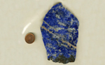 Bright blue mottled Sodalite slab with a strong color and vague arrowhead shape.
