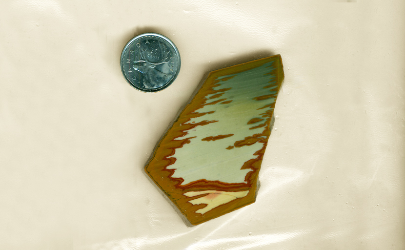 Slab of blue, green, red, yellow and brown Owyhee Picture Jasper, a complex desert scene.