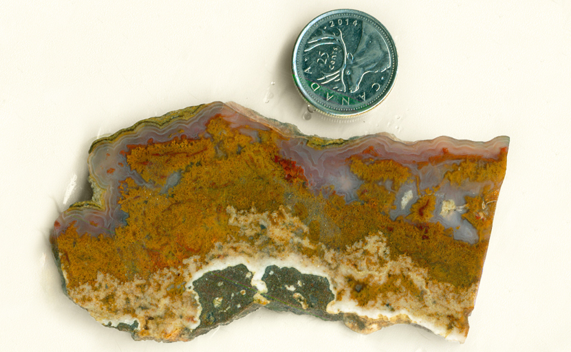 Orange, purple, red and blue slab of Cathedral Agate from Mexico.