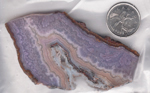 Slab of Mexican Royal Aztec Agate, with purple lace patterns and a band of pink.