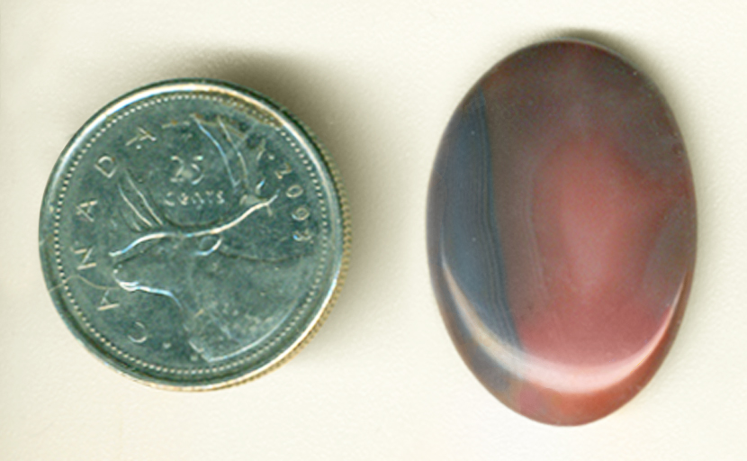 Pink and blue triangular-patterend cabochon of Agate from Botswana.