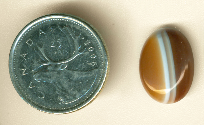 Coffee- and caramel-colored Uruguay Agate with two lines down the middle.