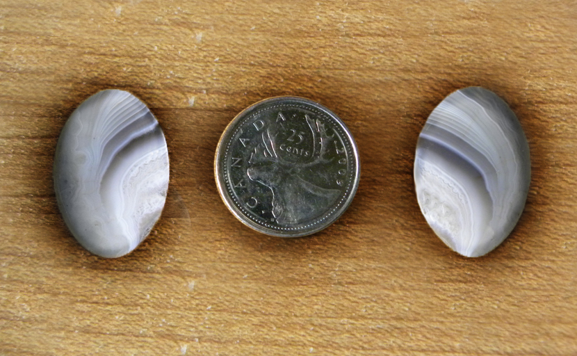 Matching set of 2 Botswana Agate cabochons from Africa, with lines of purple and gray that fan to the side like wings.