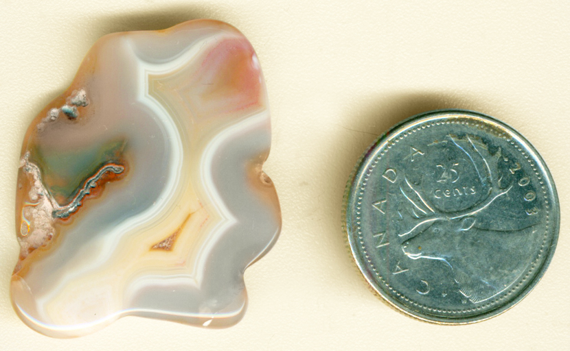Pink, yellow, blue and white Coyamito Agate polished freeform from Mexico.
