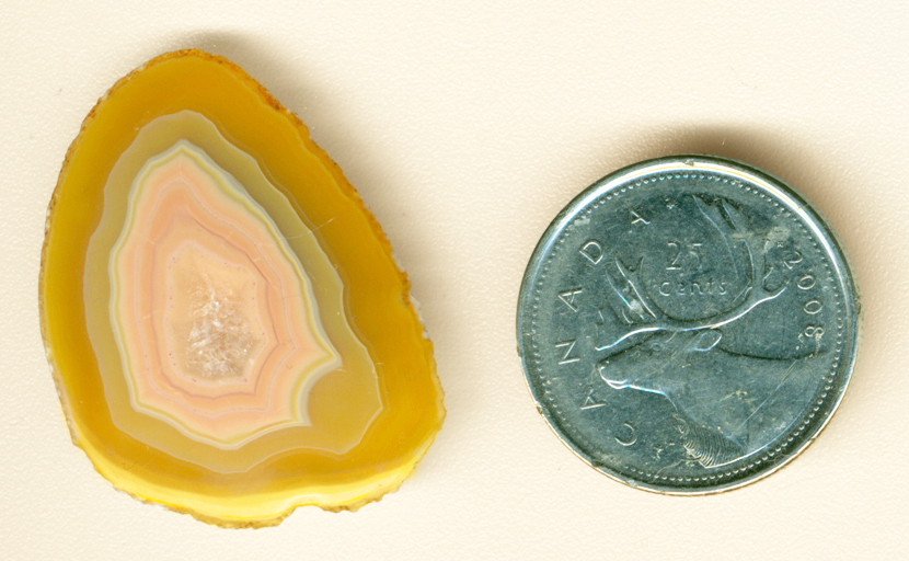 Orange, pink and yellow polished freeform Moctezuma Agate from Mexico.