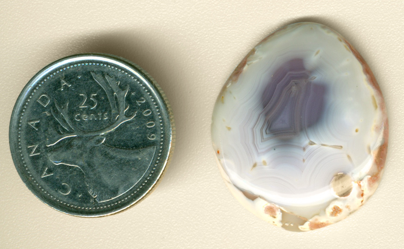 Violet spot in the middle of a white Fortification Agate from Mexico.