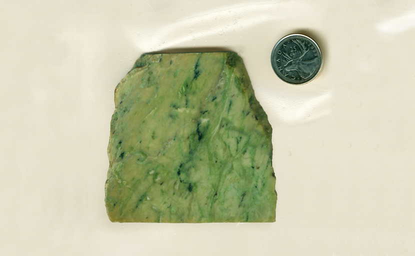 Slab of Jade from California, with streaks of bright green and bluish-green across a green background!