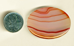 Large oval scarlet, pink and yellow striped Brazilian Agate cabochon.