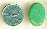 Shimmering green Aventurine cabochon from India, with refractive, multi-color sparkles.