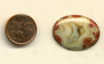 Calibrated oval polished Fairburn Agate cabochon from Nebraska or South Dakota, with a creamy star pattern, bordered by layers of red chalcedony.