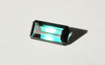 Bright blue-green step-cut faceted Tourmaline from Africa.