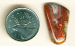 Reddish-brown and blue fortification in a trapezoidal cabochon of Crazy Lace Agate from Mexico.