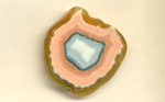 A freeform polished Coyamito Agate from Mexico, with an orange layer around the outside, within which rests a salmon pink layer, all surrounding a greyish blue center, fading into white, with fortification patterns all over it.