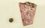 A trapezoid shaped slab of Mexican Flame Agate with pink flame patterns on a white background.