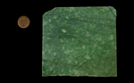 A square slab of Emerald Snowflake Jade, mottled green, heavy and dense.