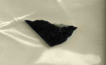 A triangular slab of dense black jade, from the Red Desert of Wyoming.