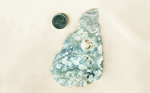 Blue-gray Rhyolite, full of semi-circular light-colored patterns and other, less regular shapes.