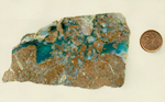 Translucent bright blue chalcedony in broken brown matrix.