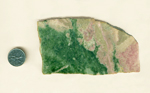 A slab of Pink and Green Jade from Wyoming, equal parts pink Thulite and Green Jade, joined in an uneven line. 